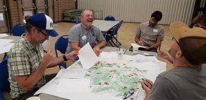 image of people at a table participating in a CFCN Mapping Exercise