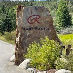 image is a Stone monument with the Ruby Ranch logo