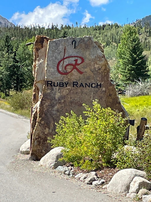 image is a Stone monument with the Ruby Ranch logo
